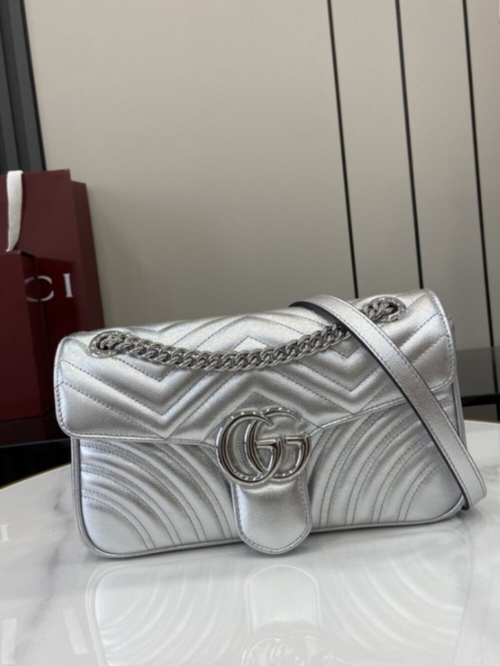 Gucci's silver GG Marmont shoulder bag is crafted from metallic quilted lambskin